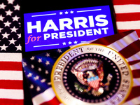 'Harris for President' sign is displayed on a mobile phone screen with US flag in the background for illustration photo. Krakow, Poland on N...