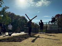 A man carries a large wooden cross near the White House in Washington DC, USA on 05 November, 2024. (