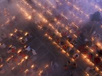 Hindu devotees sit together on the floor of Loknath Temple to observe the Rakher Upobash festival to honor Baba Lokenath, an 18th Century Hi...