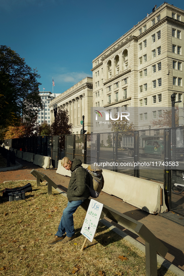 A man with a sign is seen in Lafayette Park in Washington DC, USA on 05 November, 2024. 