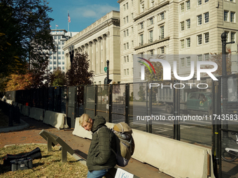 A man with a sign is seen in Lafayette Park in Washington DC, USA on 05 November, 2024. (