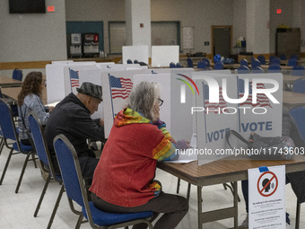 People cast their votes on Election Day in Fairfax County, Virginia, on November 5, 2024. (