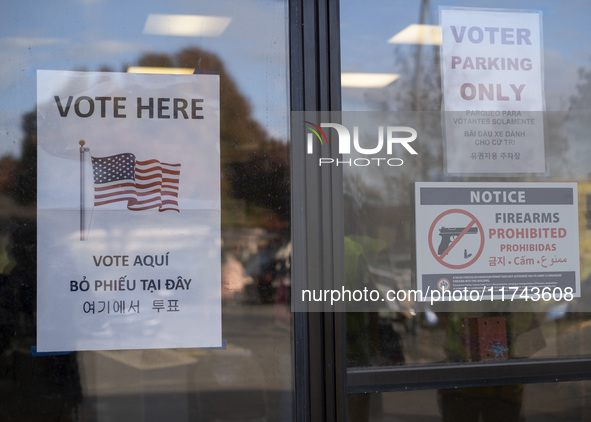 A ''Vote Here'' sign is seen outside a Vote Center on Election Day in Fairfax County, Virginia, on November 5, 2024. 