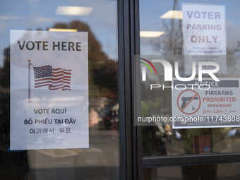 A ''Vote Here'' sign is seen outside a Vote Center on Election Day in Fairfax County, Virginia, on November 5, 2024. (