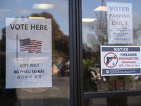 A ''Vote Here'' sign is seen outside a Vote Center on Election Day in Fairfax County, Virginia, on November 5, 2024. (