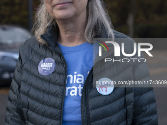 A supporter of Kamala Harris stands outside a Vote Center in Fairfax County, Virginia, on November 5, 2024. (