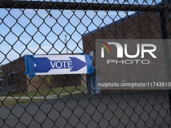 A vote sign is seen outside a Vote Center on Election Day in Fairfax County, Virginia, on November 5, 2024. (