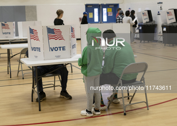 People cast their votes on Election Day in Fairfax County, Virginia, on November 5, 2024. 