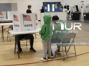 People cast their votes on Election Day in Fairfax County, Virginia, on November 5, 2024. (