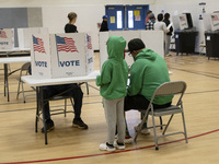 People cast their votes on Election Day in Fairfax County, Virginia, on November 5, 2024. (