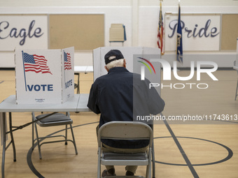 People cast their votes on Election Day in Fairfax County, Virginia, on November 5, 2024. (