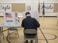 People cast their votes on Election Day in Fairfax County, Virginia, on November 5, 2024. (