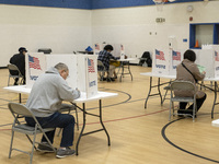 People cast their votes on Election Day in Fairfax County, Virginia, on November 5, 2024. (