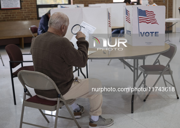 People cast their votes on Election Day in Fairfax County, Virginia, on November 5, 2024. 