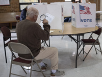 People cast their votes on Election Day in Fairfax County, Virginia, on November 5, 2024. (