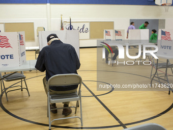 People cast their votes on Election Day in Fairfax County, Virginia, on November 5, 2024. (