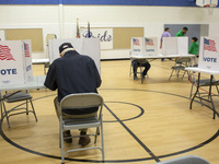 People cast their votes on Election Day in Fairfax County, Virginia, on November 5, 2024. (