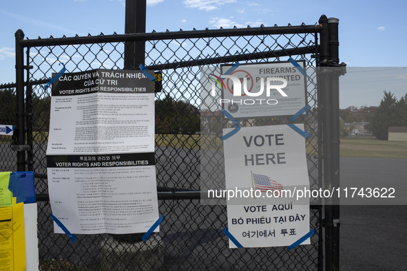 A ''Vote Here'' sign is seen outside a Vote Center on Election Day in Fairfax County, Virginia, on November 5, 2024. 