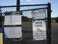 A ''Vote Here'' sign is seen outside a Vote Center on Election Day in Fairfax County, Virginia, on November 5, 2024. (