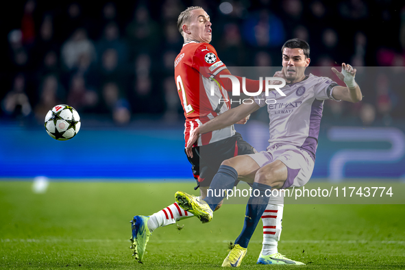 PSV Eindhoven defender Rick Karsdorp and Girona FC defender Miguel Gutierrez play during the match between PSV and Girona at the Philips Sta...