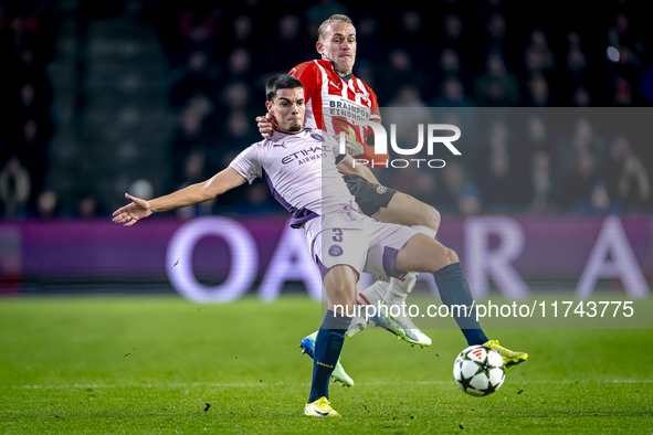 PSV Eindhoven defender Rick Karsdorp and Girona FC defender Miguel Gutierrez play during the match between PSV and Girona at the Philips Sta...