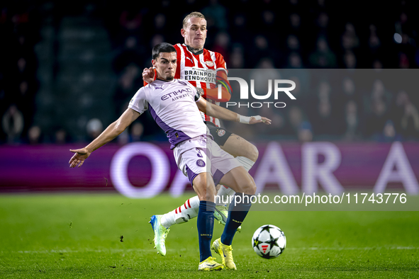 PSV Eindhoven defender Rick Karsdorp and Girona FC defender Miguel Gutierrez play during the match between PSV and Girona at the Philips Sta...