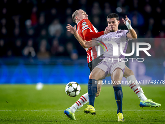 PSV Eindhoven defender Rick Karsdorp and Girona FC defender Miguel Gutierrez play during the match between PSV and Girona at the Philips Sta...