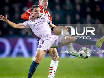 PSV Eindhoven defender Rick Karsdorp and Girona FC defender Miguel Gutierrez play during the match between PSV and Girona at the Philips Sta...