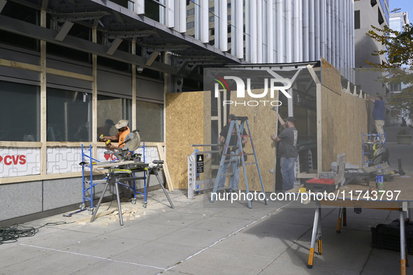 Downtown DC businesses board up windows during the Presidential Election in Washington DC, USA, on November 5, 2024, at 19th Street. 