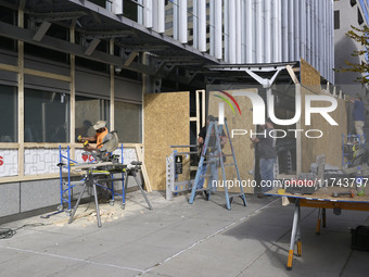 Downtown DC businesses board up windows during the Presidential Election in Washington DC, USA, on November 5, 2024, at 19th Street. (