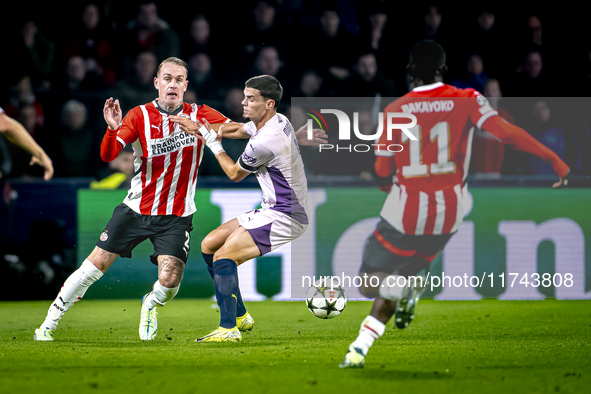 PSV Eindhoven defender Rick Karsdorp and Girona FC defender Miguel Gutierrez play during the match between PSV and Girona at the Philips Sta...