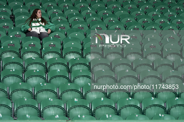 A Sporting CP fan awaits the start of the UEFA Champions League match between Sporting CP and Manchester City at Jose Alvalade Stadium in Li...