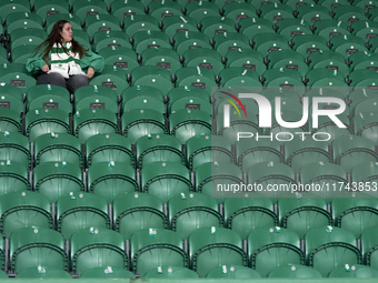 A Sporting CP fan awaits the start of the UEFA Champions League match between Sporting CP and Manchester City at Jose Alvalade Stadium in Li...