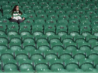 A Sporting CP fan awaits the start of the UEFA Champions League match between Sporting CP and Manchester City at Jose Alvalade Stadium in Li...