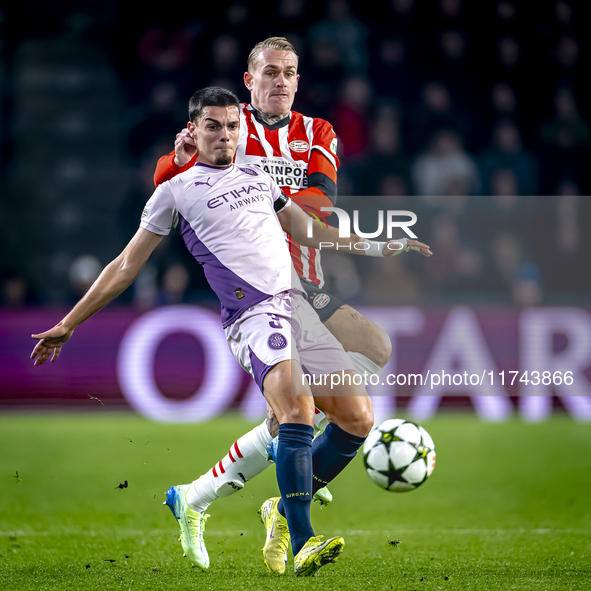 PSV Eindhoven defender Rick Karsdorp and Girona FC defender Miguel Gutierrez play during the match between PSV and Girona at the Philips Sta...