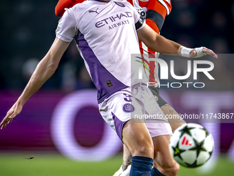 PSV Eindhoven defender Rick Karsdorp and Girona FC defender Miguel Gutierrez play during the match between PSV and Girona at the Philips Sta...