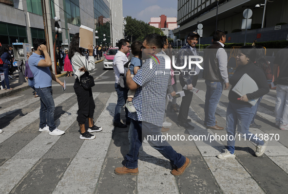 Americans and people living in Mexico go to the United States embassy in Mexico City, Mexico, on November 5, 2024, for the elections in the...