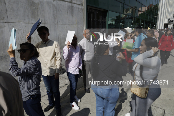 Americans and people living in Mexico go to the United States embassy in Mexico City, Mexico, on November 5, 2024, for the elections in the...