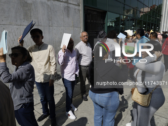 Americans and people living in Mexico go to the United States embassy in Mexico City, Mexico, on November 5, 2024, for the elections in the...