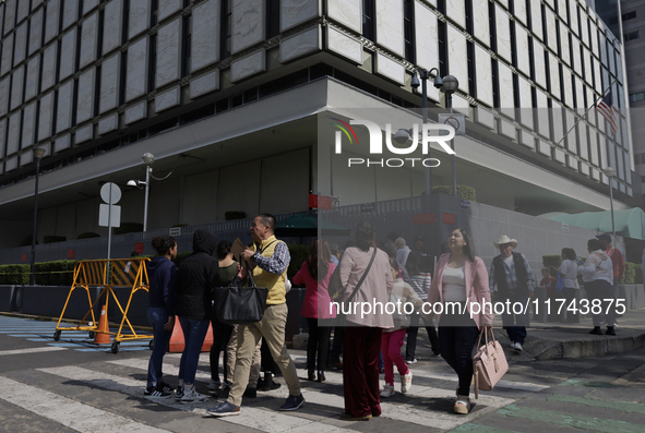 Americans and people living in Mexico go to the United States embassy in Mexico City, Mexico, on November 5, 2024, for the elections in the...