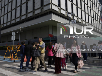 Americans and people living in Mexico go to the United States embassy in Mexico City, Mexico, on November 5, 2024, for the elections in the...