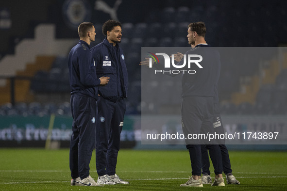 Wycombe Wanderers F.C. players inspect the pitch during the Sky Bet League 1 match between Stockport County and Wycombe Wanderers at the Edg...