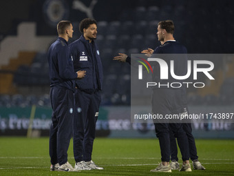 Wycombe Wanderers F.C. players inspect the pitch during the Sky Bet League 1 match between Stockport County and Wycombe Wanderers at the Edg...