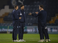 Wycombe Wanderers F.C. players inspect the pitch during the Sky Bet League 1 match between Stockport County and Wycombe Wanderers at the Edg...