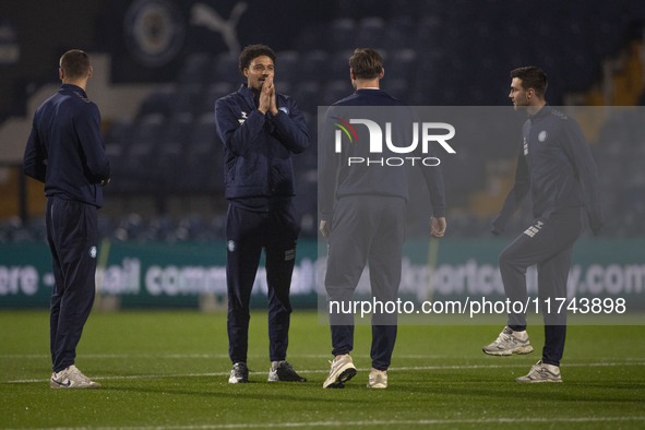 Wycombe Wanderers F.C. players inspect the pitch during the Sky Bet League 1 match between Stockport County and Wycombe Wanderers at the Edg...