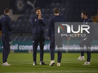 Wycombe Wanderers F.C. players inspect the pitch during the Sky Bet League 1 match between Stockport County and Wycombe Wanderers at the Edg...