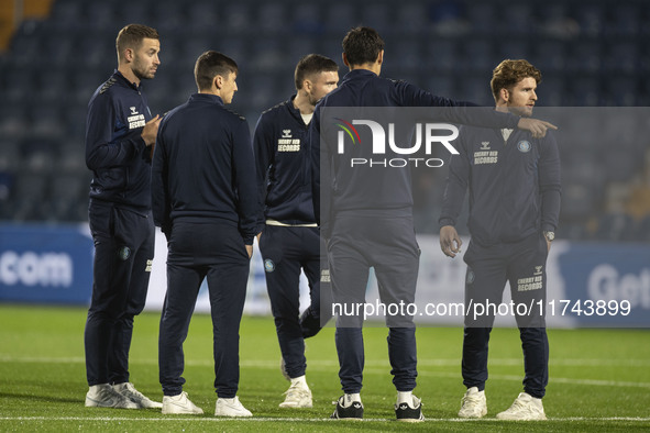 Wycombe Wanderers F.C. players inspect the pitch during the Sky Bet League 1 match between Stockport County and Wycombe Wanderers at the Edg...