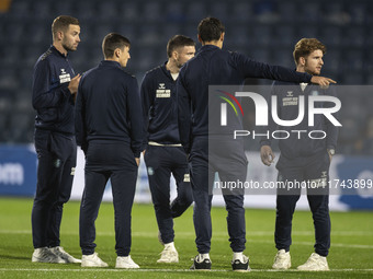 Wycombe Wanderers F.C. players inspect the pitch during the Sky Bet League 1 match between Stockport County and Wycombe Wanderers at the Edg...