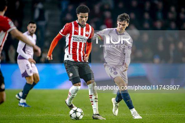 PSV Eindhoven midfielder Malik Tillman and Girona FC midfielder Silvi Clua play during the match between PSV and Girona at the Philips Stadi...