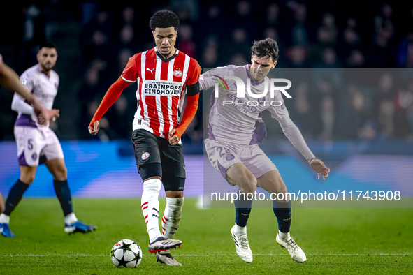 PSV Eindhoven midfielder Malik Tillman and Girona FC midfielder Silvi Clua play during the match between PSV and Girona at the Philips Stadi...